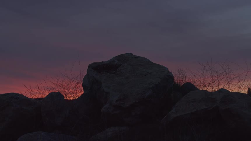 The sun is rising on the mountain