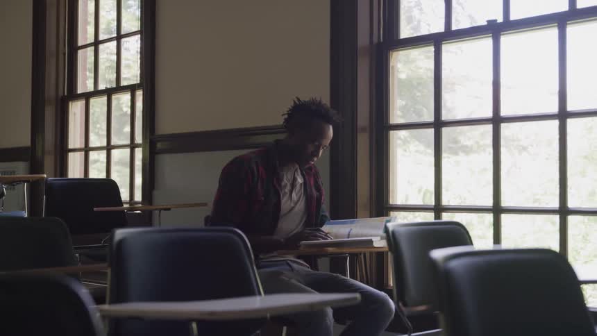Man studying alone in classroom