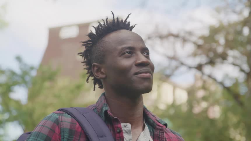 Man outdoors with happy expression