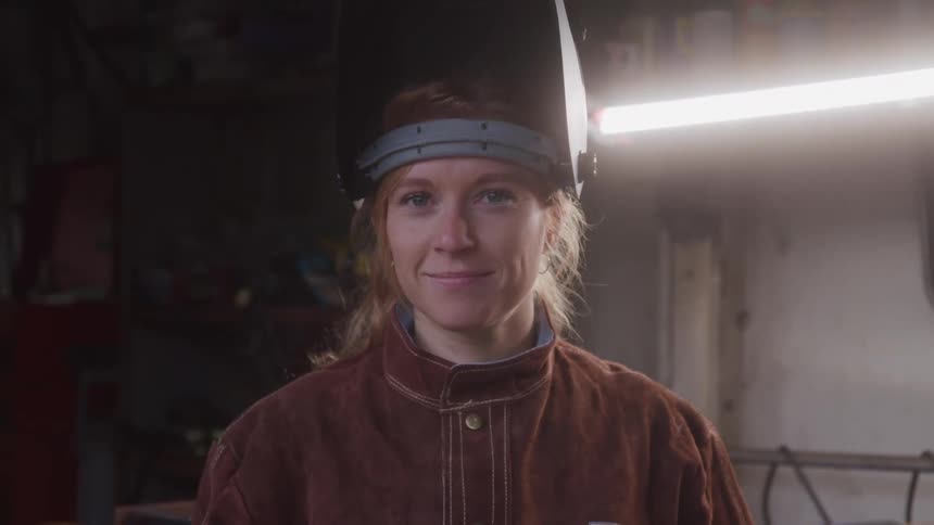 Woman inside a workshop with a protective mask
