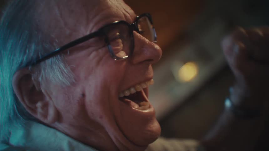Elderly man jumping for joy