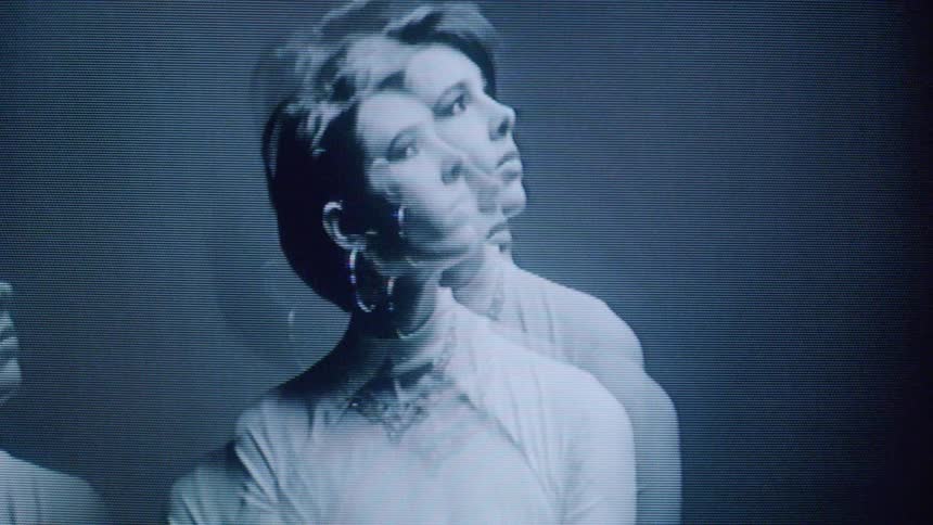 The model rotates her head as she poses