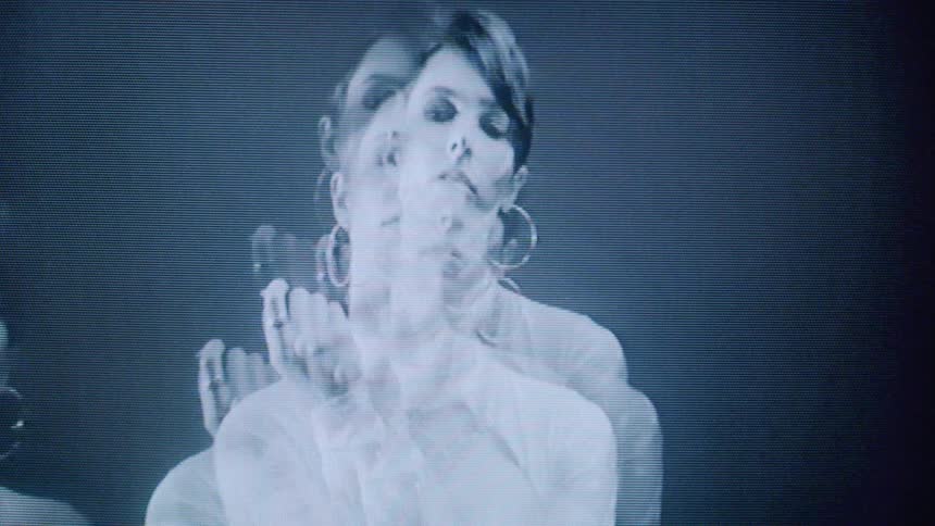 The model is mirrored as she moves around