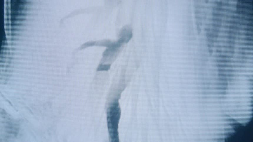 Screen displaying the silhouette of a dancing woman
