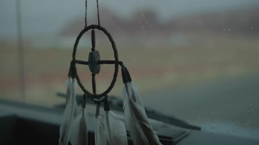 A dream catcher inside of a car