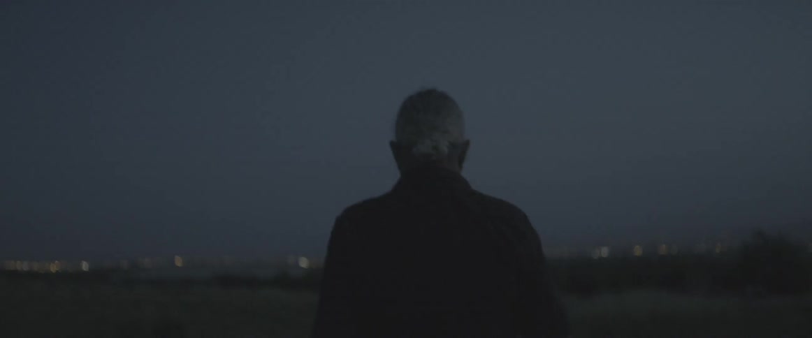 Man walking outside at night