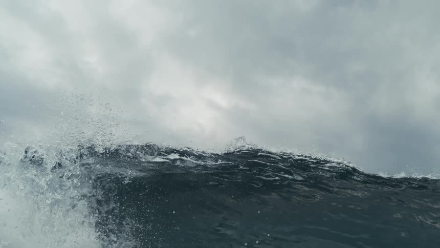 Wave breaking in the ocean on a cloudy day