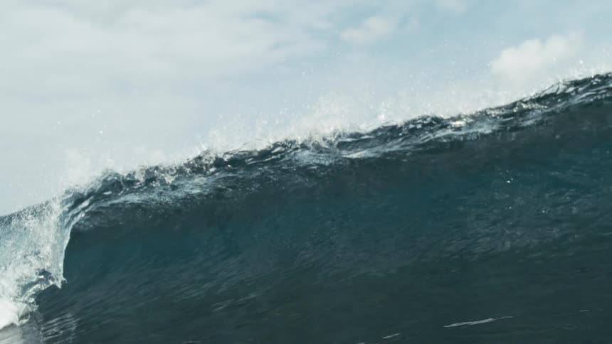 Heavy ocean waves crashing at midday