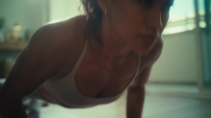 Woman indoors doing pushups