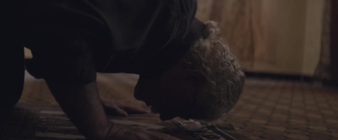 Man bowing down on the carpet indoor
