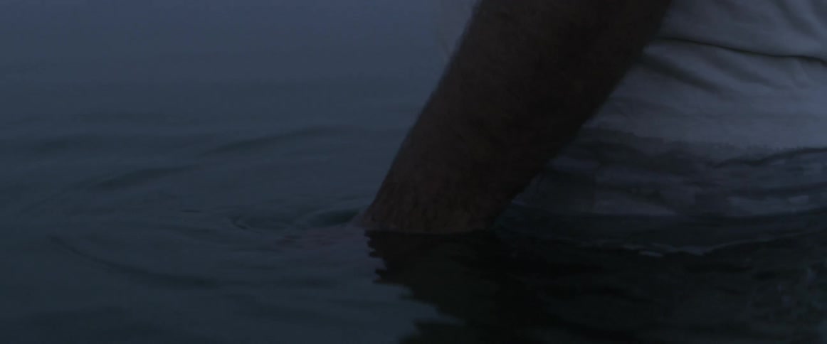 A man stands in a body of water