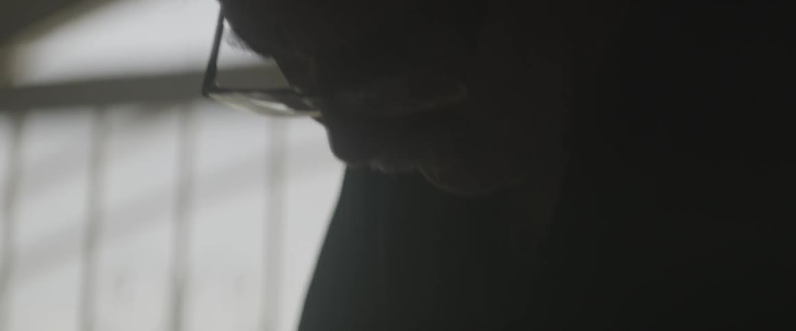 A man is looking down working