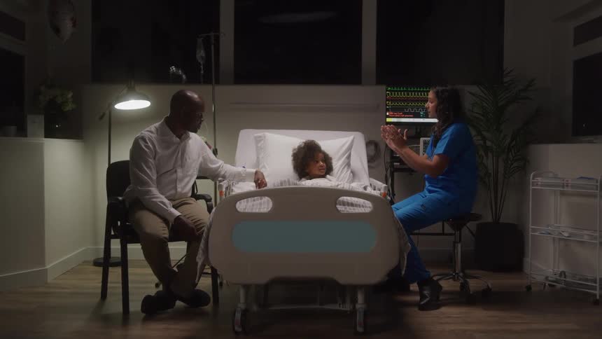 A doctor is talking with a patient and a visitor