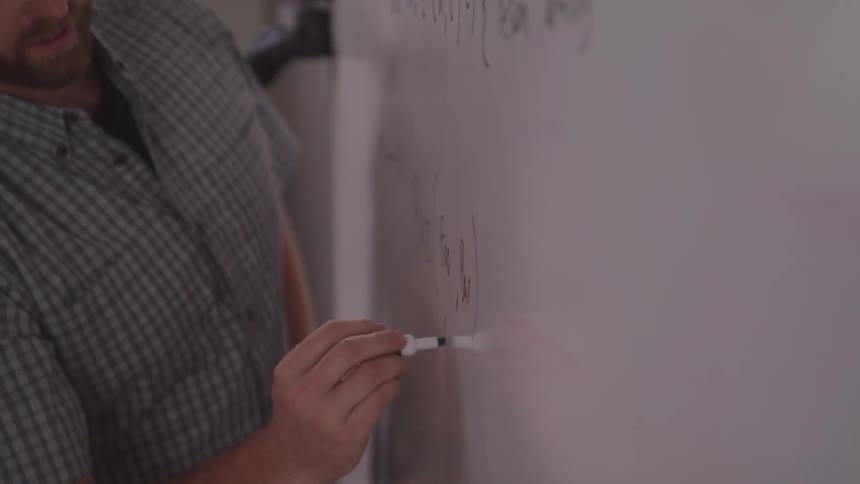 Man writing on a board