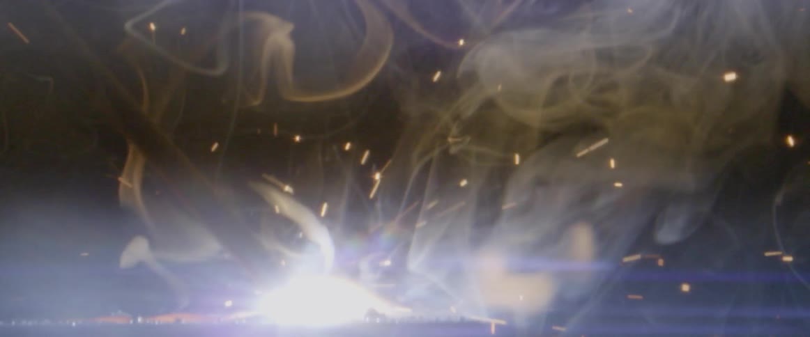 Sparks and fire in a dim room