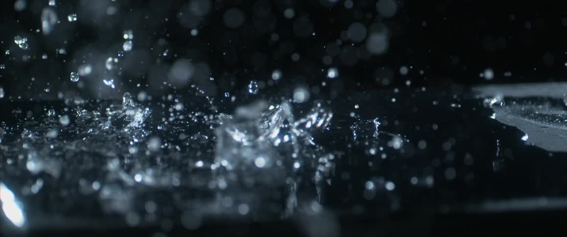 A hammer hitting glass