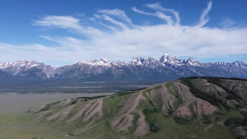A large mountain range is on the horizon
