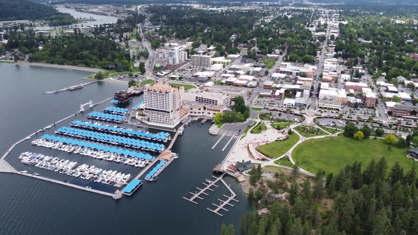Aerial view of marina with boats by lakeside town