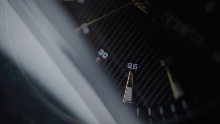 The video displays a closeup of a wristwatch focusing on the intricate details of its face the minute and hour hands are visible with the minute hand steadily ticking forward indicating the passage of time