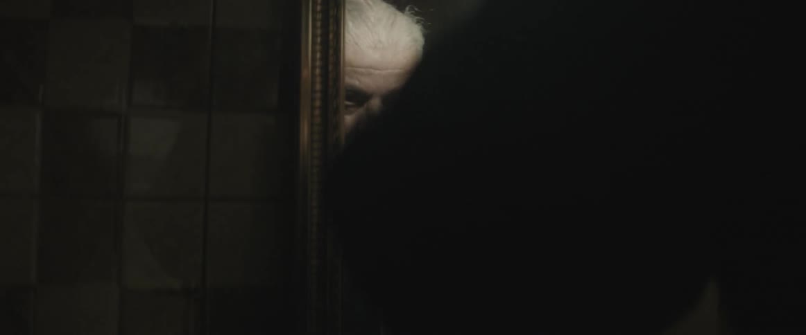 Man looking at himself in a mirror