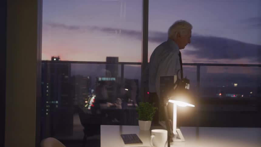 A man paces in the office