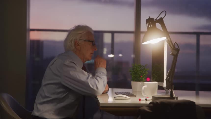 The man points at the monitor after typing