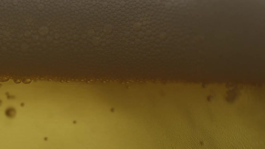 The bubbles float around in the beer