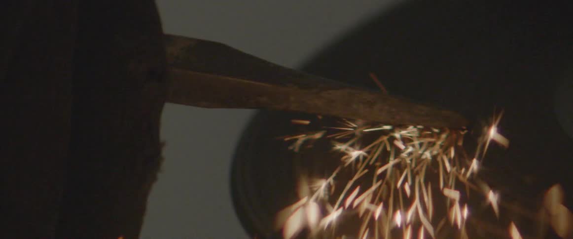 Sparks fly from a rotating power tool