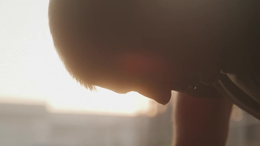 Man with face dripping with sweat