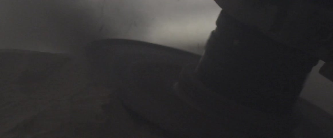 A heavy duty sander runs across the surface of a stone
