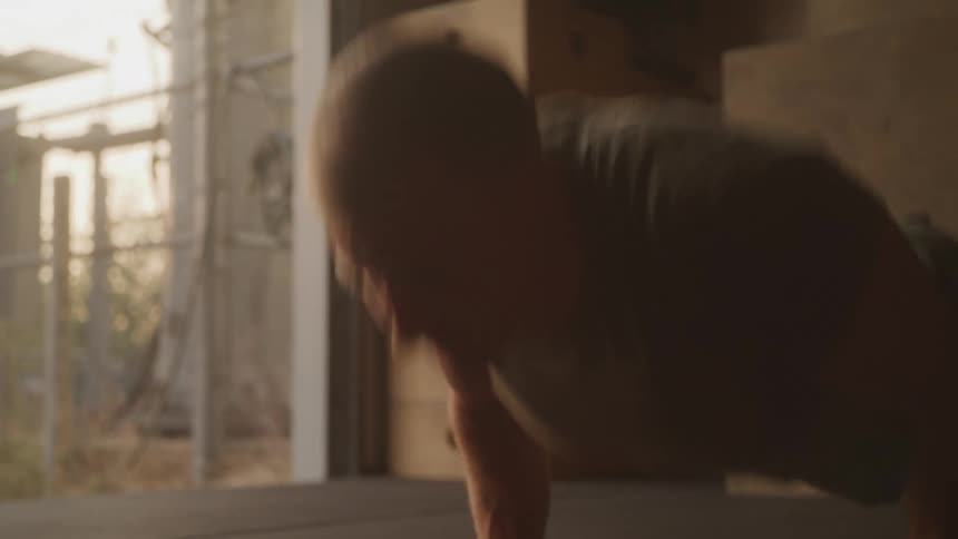 Man doing pushups in a gym