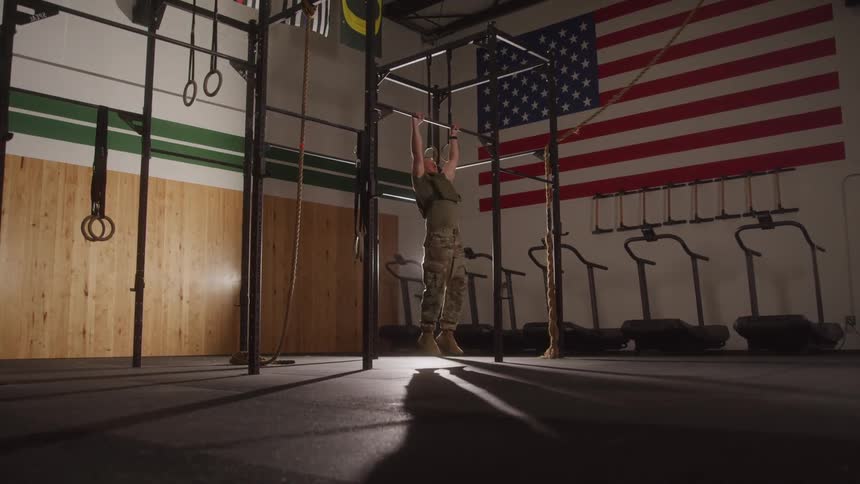 Man doing pullups at a gym