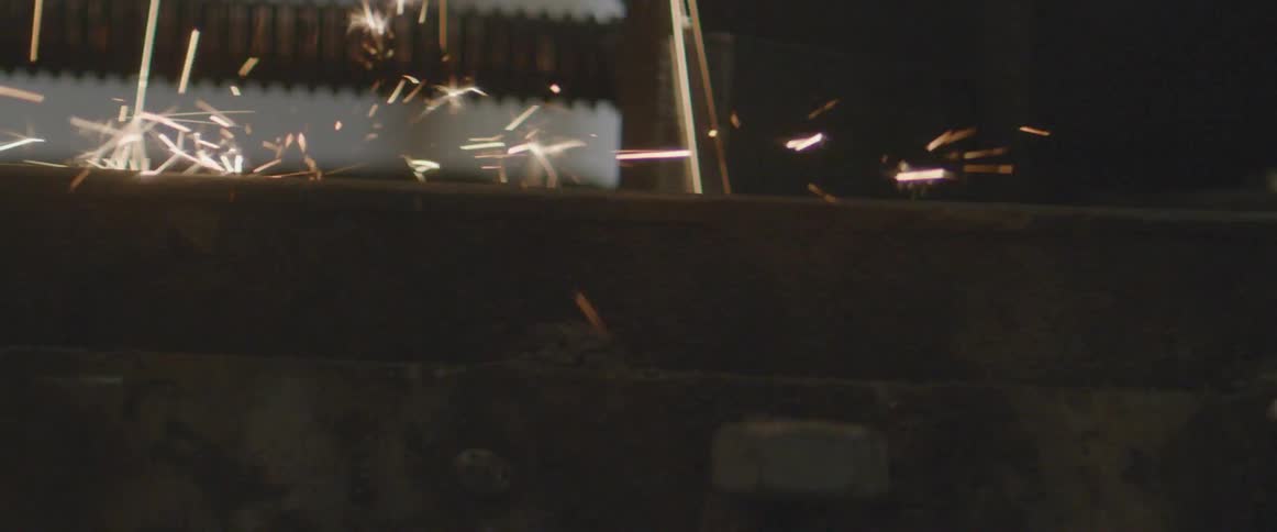 Sparks flying onto table in workshop