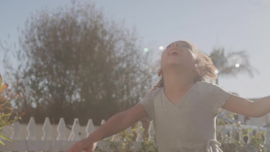 The girl chases after the bubbles