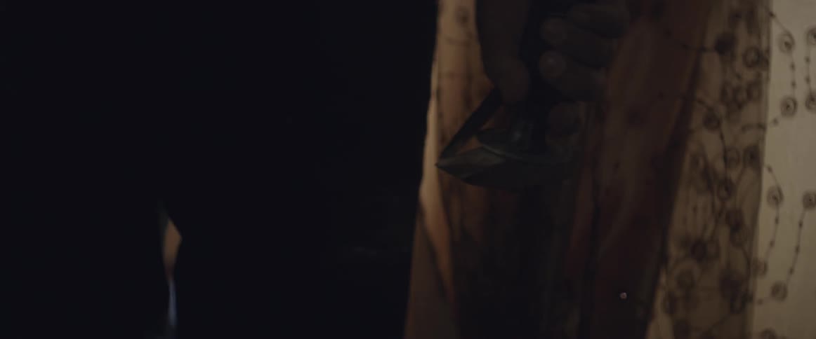A man carries a chisel and hammer