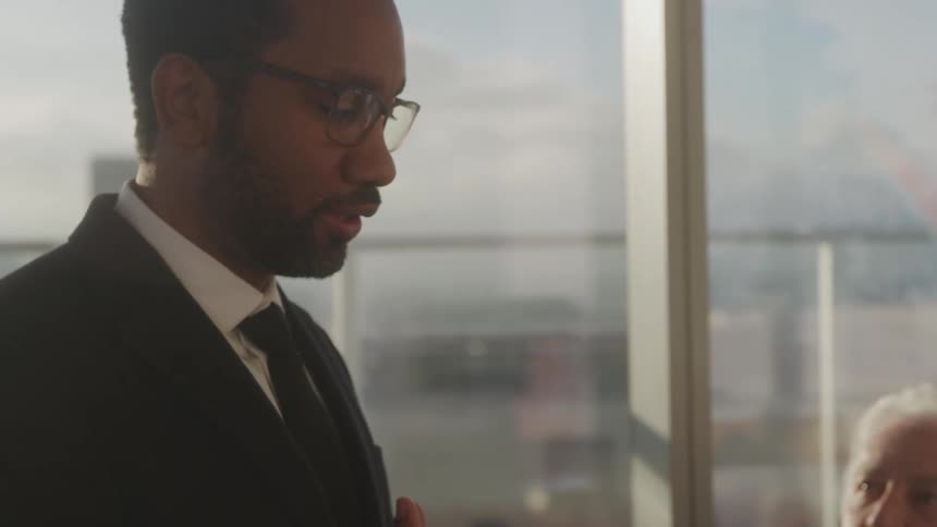 Two men in an office talking