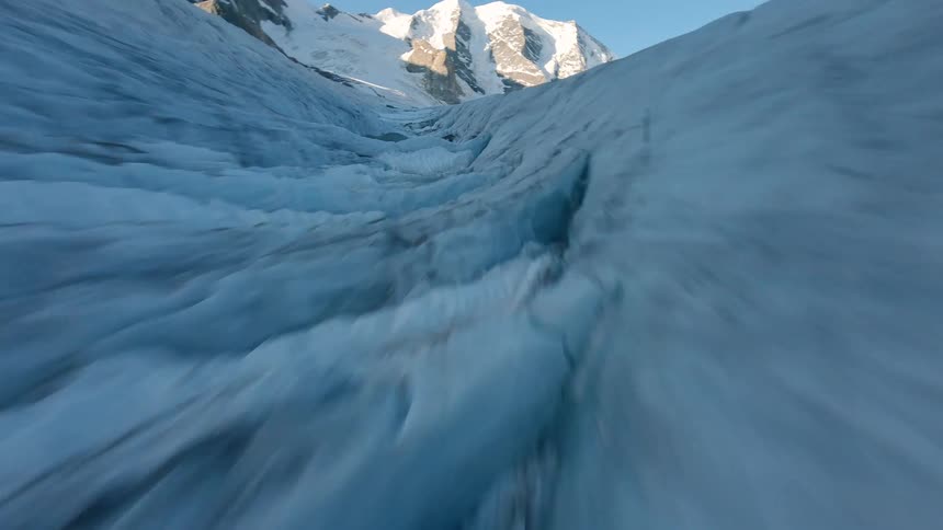 A snowcovered mountain in the arctic at midday