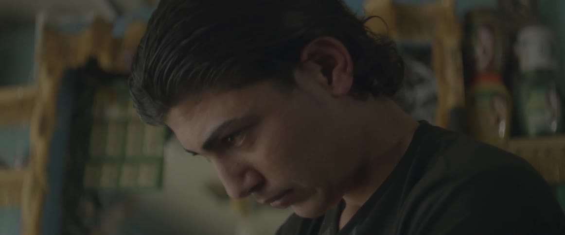 A man stares intently downwards