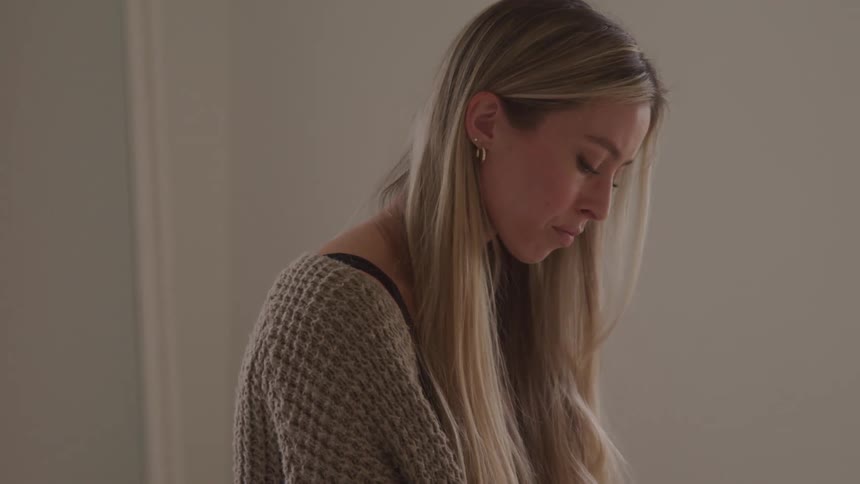 A sad woman with long blonde hair