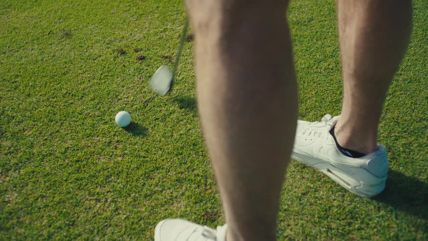 The man drives the golf ball