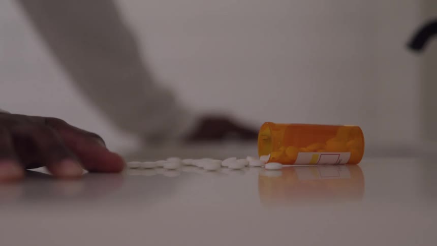 The pills are spilled out from the bottle