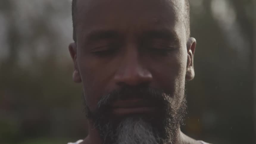 The man slowly opens his eyes