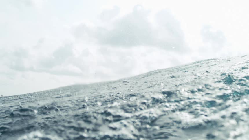 Waves seen from the sea on a cloudy day