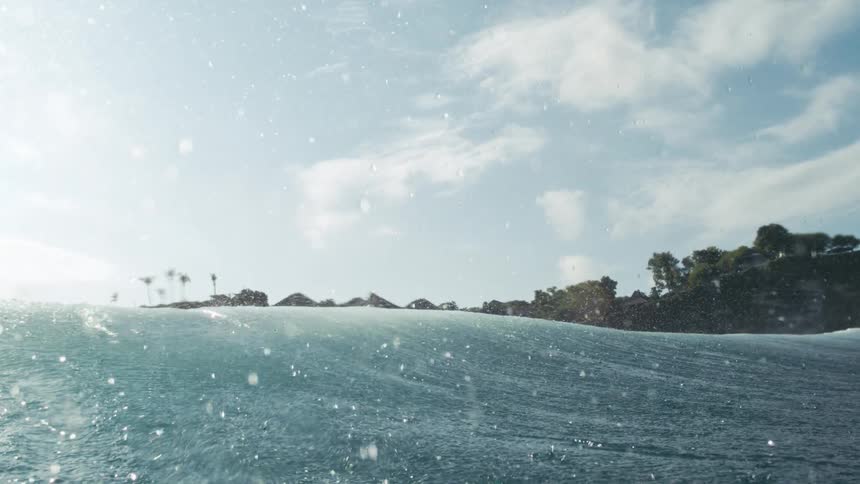 The water sprays up from the wave