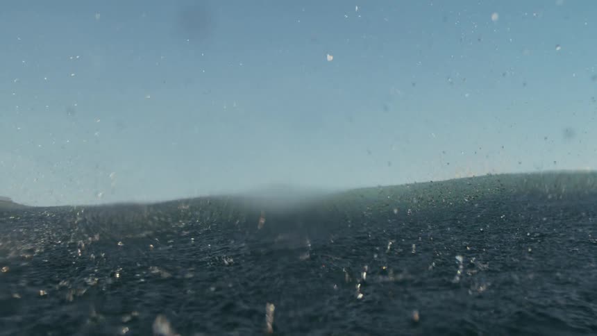 Water splashing into the ocean from a breaking wave