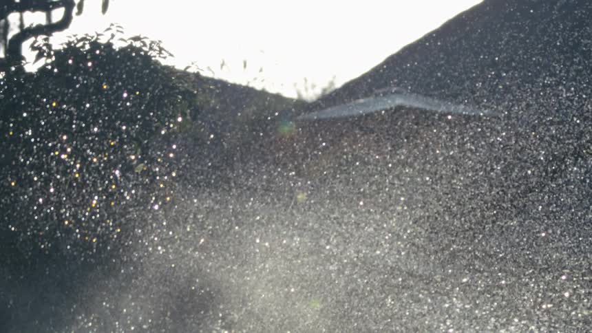 Sunbeams pass through water droplets in the air
