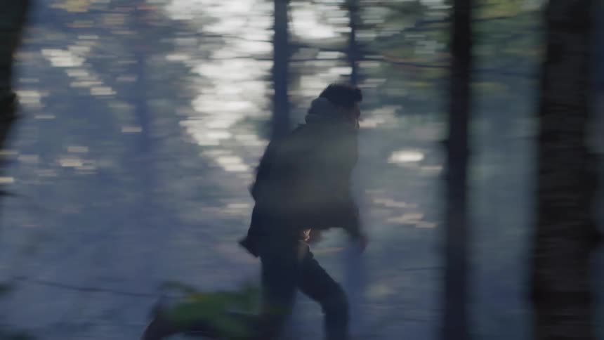 Man runs through the forest