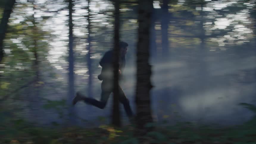 Man running in a forest