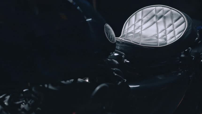 Motorcycle with leather seat in an interior space