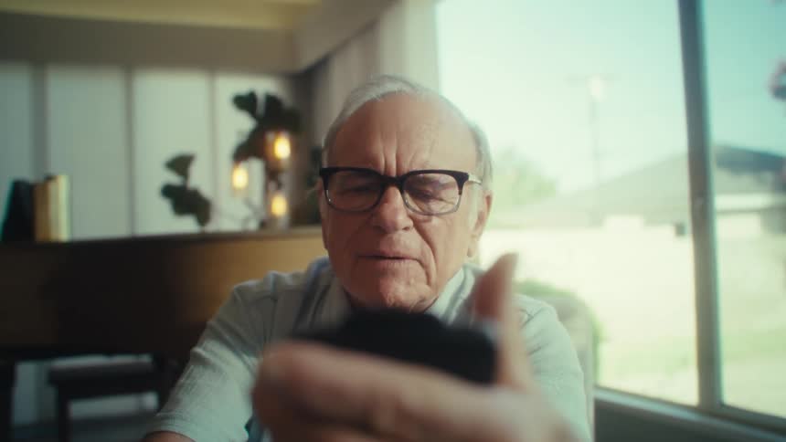 The man gets happy while using a cell phone